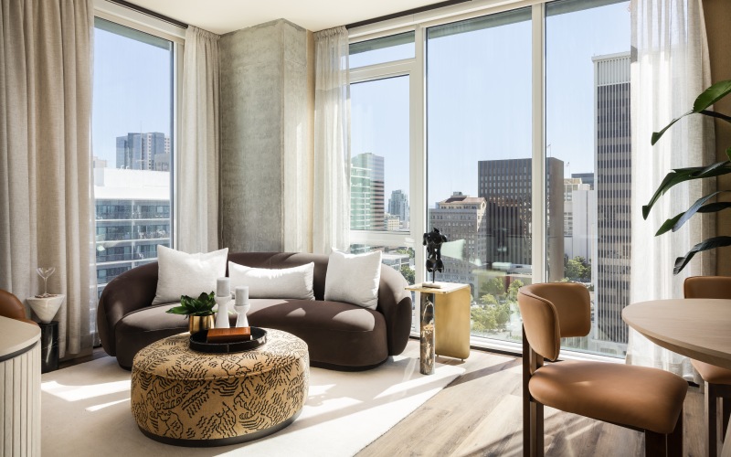 spacious living area with floor to ceiling windows