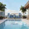 a pool with a building in the background